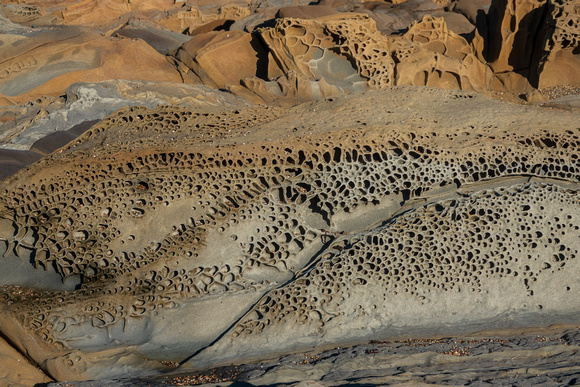 Sandstone Formations on Pebble Beach (Closer)